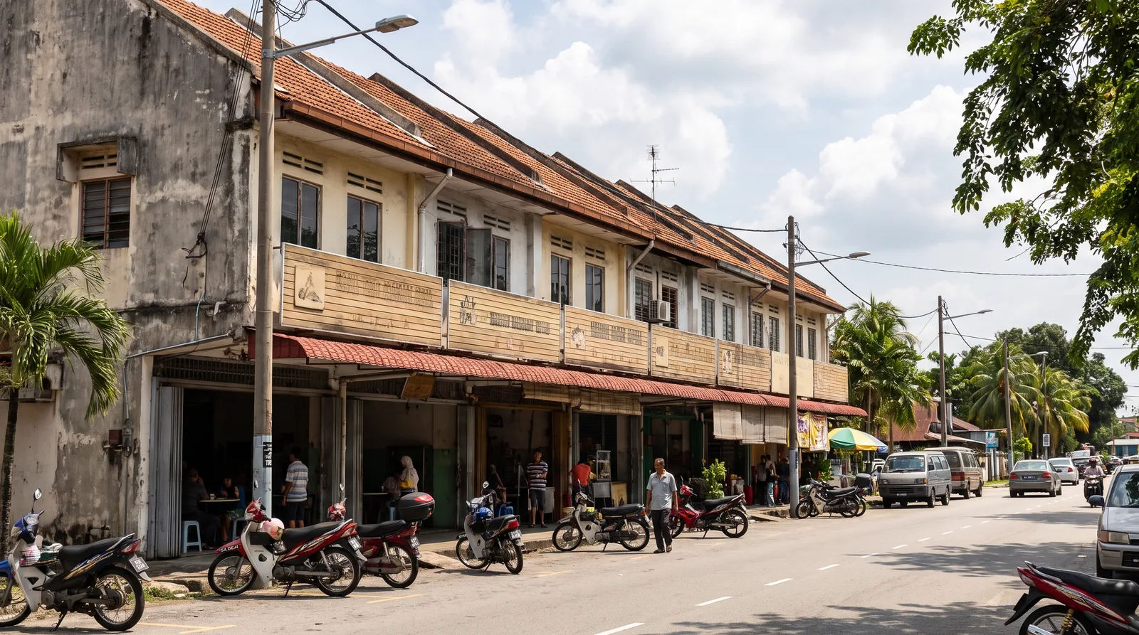 row of Malaysian shoplots with compliant horizontal fascia signboards above the covered walkway