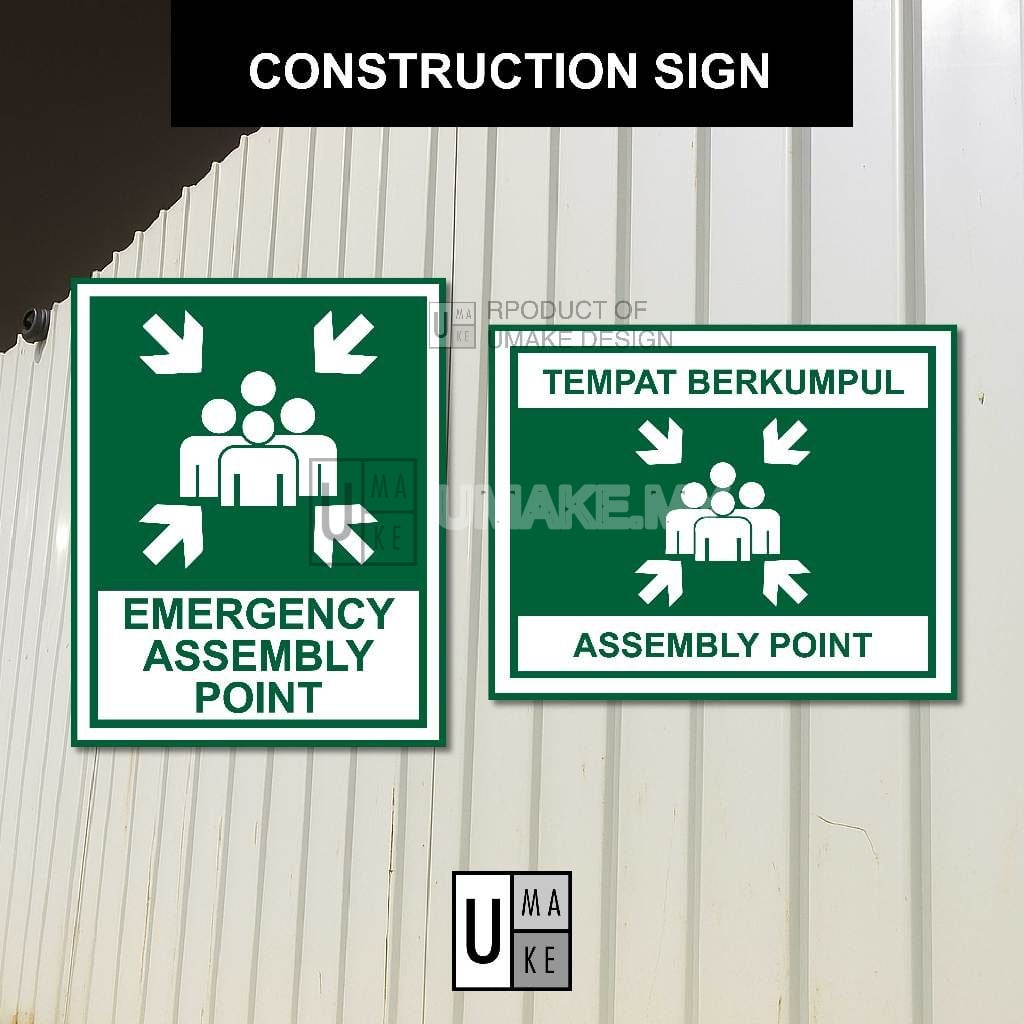 Two assembly point signs side by side: a portrait emergency assembly point sign and a horizontal tempat berkumpul sign