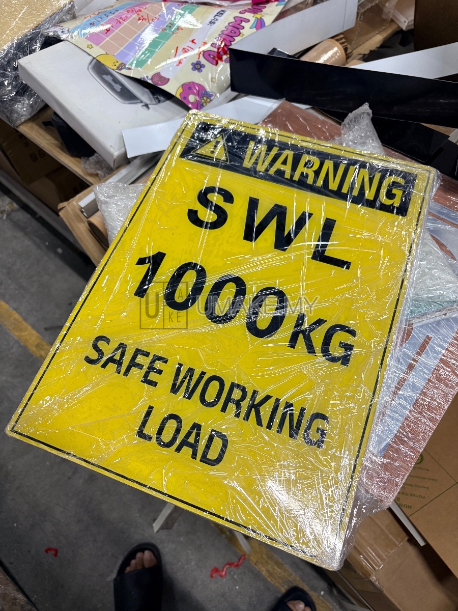 A sleek acrylic warning sign with reverse UV printing, mounted on a wall, showcasing crisp text and bold red safety symbols.